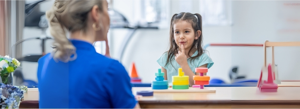 Child receiving pediatric speech therapy in Metairie clinic setting